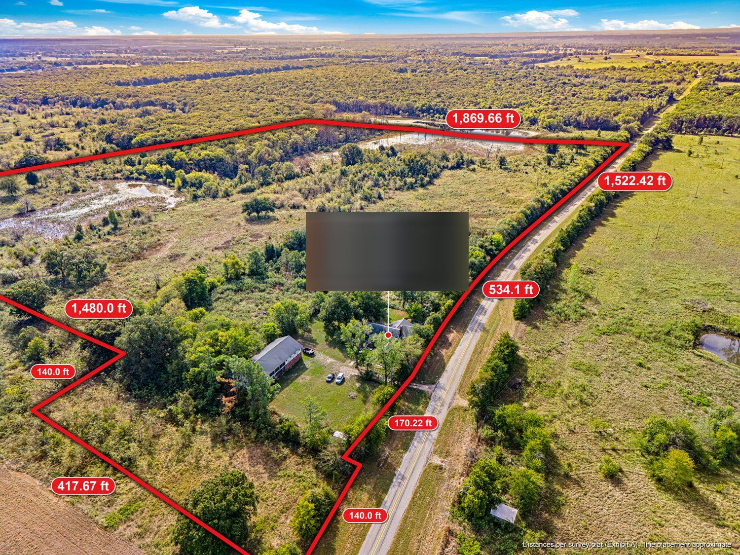 Drone photo of the whole parcel from the northeast, with the red surveyed boundary line