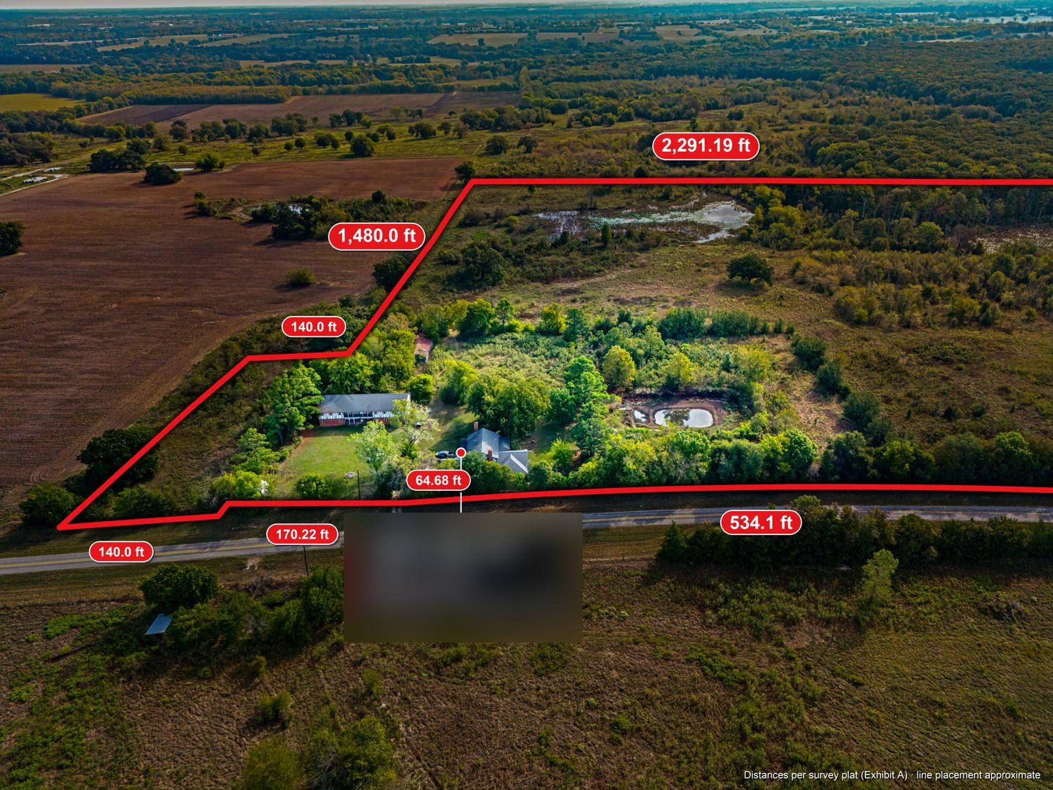 Drone photo of the whole parcel from the southeast, with the red surveyed boundary line